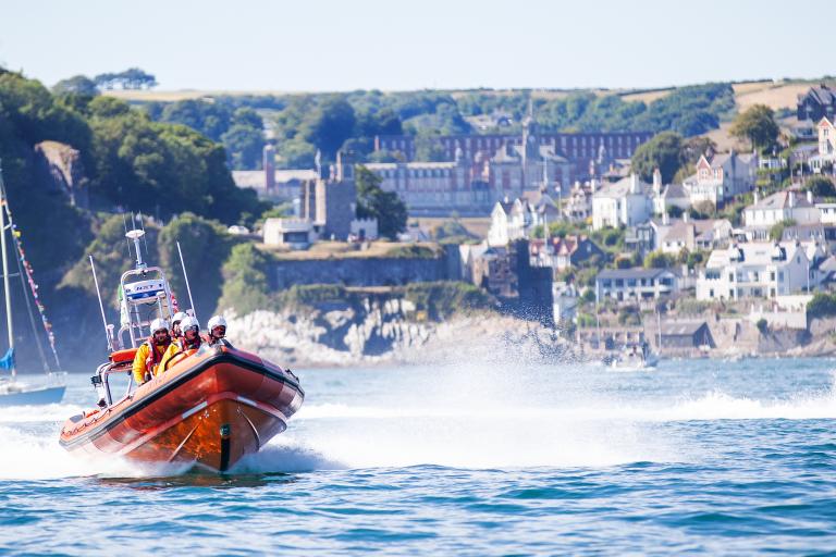 A lifeboat in action out on the water in the South Hams. The boat is a speedboat, designed for quick response.