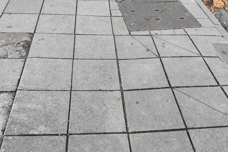 A pavement in Kingsbridge looking mucky with chewing gum.