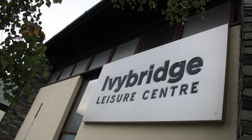 A photo of the entrance to Ivybridge Leisure Centre, highlighting the entry sign with the name of the centre on it.