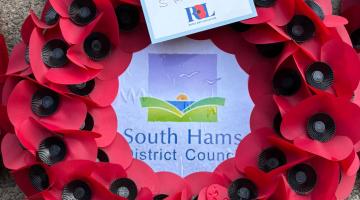 The South Hams Council poppy wreath on the Totnes War Memorial.