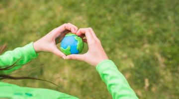 hands holding an earth