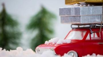 RED CAR WITH GIFTS ON TOP