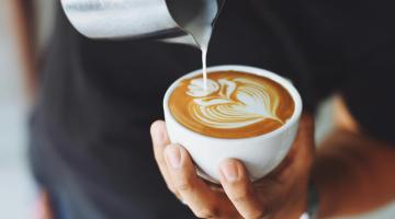 hand holding coffee cup