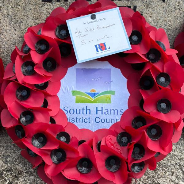 The South Hams Council poppy wreath on the Totnes War Memorial.