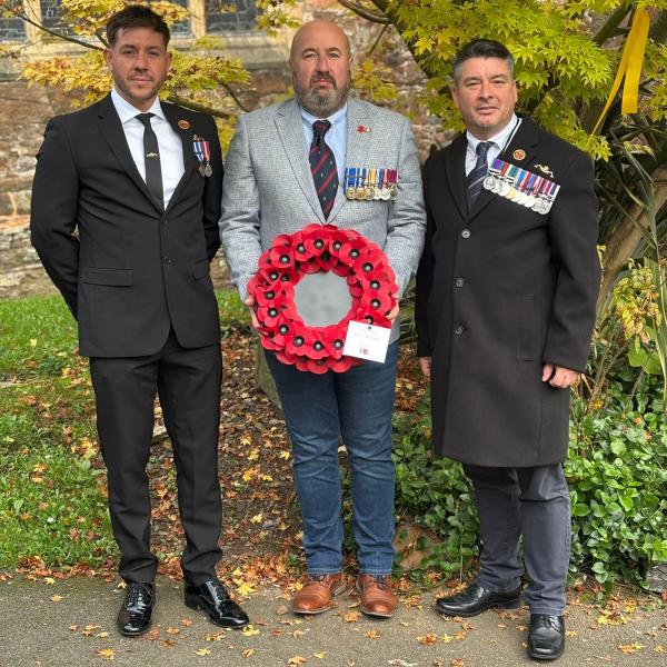 Waste staff with the South Hams poppy wreath ahead of the Remembrance Day service this morning.